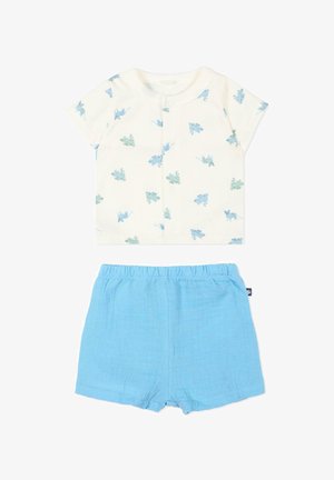 Biały, krótkim rękawem koszulka dla niemowląt z niebieskimi i zielonymi nadrukami dinozaurów, zestawiona z jasnoniebieskimi szortami z elastyczną talią.