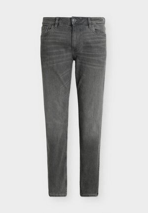 Jeans grigi in denim slim fit con chiusura frontale con bottoni e zip, passanti per cintura e design a cinque tasche su sfondo bianco semplice.