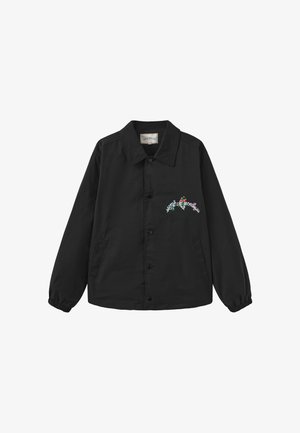 Sort jakke med knapper, krave, elastiske manchetter, sidelommer og lille farverig blomsterbroderi på venstre bryst.