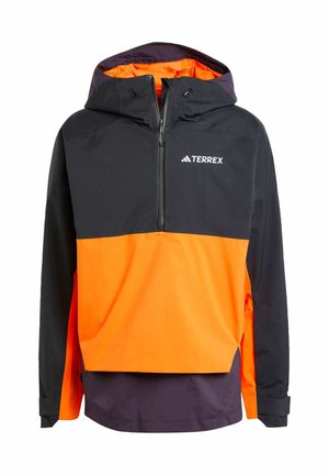 Lichtgewicht, capuchonjack met een halfrits ontwerp. Beschikt over een zwarte bovenkant, een heldere oranje onderkant en paarse accenten. Logo aan de voorkant.