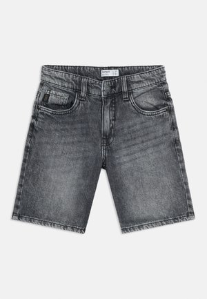 Lastete mustad pestud teksapüksid ees oleva nupu, tõmbluku, vööaasad ja viie taskuga, valgel taustal.