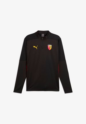 Schwarzes Sportoberteil mit langen Ärmeln und Viertel-Reißverschluss, gelbes Puma-Logo auf der rechten Brust und Racing Club de Lens-Abzeichen auf der linken Brust.