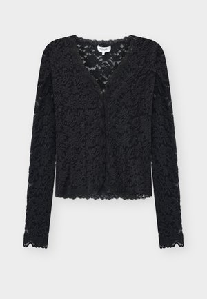 Mustavärinen pitkähihaisen pitsineuletakin, jossa on kukkakuvio, napillinen edusta ja aaltoilevat reunat hihoissa ja helmassa.