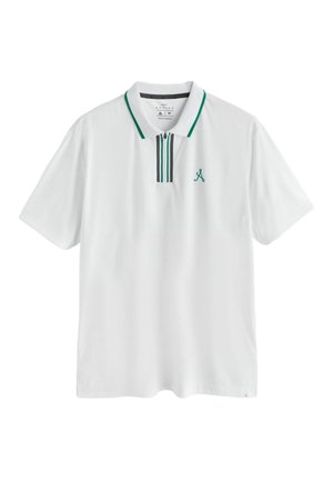 Valge lühikeste varrukatega polo-särk roheliste triipude jaotustega krae ja luku piirkonnas, väikese rohelise tikandlogo rinnal.