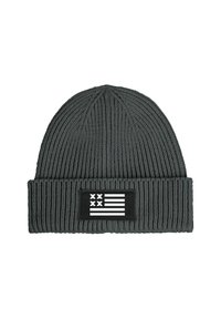 Knitted gray beanie with ribbed texture, featuring a black patch displaying a white flag design. Accented with horizontal and vertical stripes.