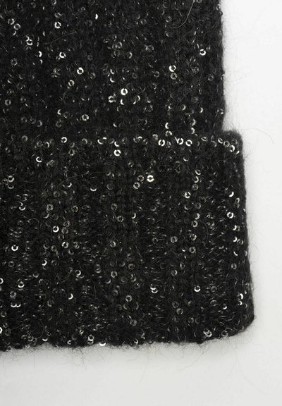 Black knit fabric section densely decorated with small, shiny black sequins spread evenly across the surface against a white background.