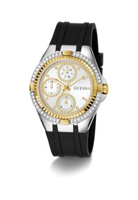 Montre analogique en or et argent avec un cadran blanc, trois sous-cadrans, accents en cristal et un bracelet en caoutchouc noir. Présente des index horaires audacieux.
