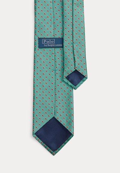 Zöld selyem nyakkendő kis piros-fehér virágmintával, tengerészkék béléssel, a Polo by Ralph Lauren címke látható a hátoldalon.