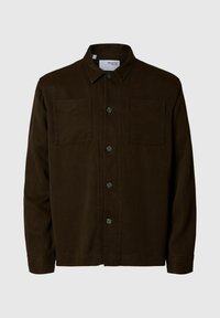 Veste chemise en velours côtelé marron avec un devant à boutons, deux poches poitrine et un col pointu. Texture douce, coupe décontractée.