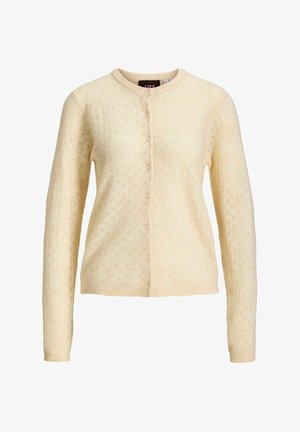 Gebreid crème kleurig lang mouw vest met ronde hals en knoopsluiting aan de voorkant.