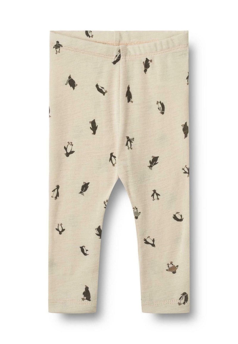 Beige Leggings aus weichem Stoff, mit einem wiederholten Pinguin-Muster in Schwarz, mit einem enganliegenden Bund und geradem Bein-Design.