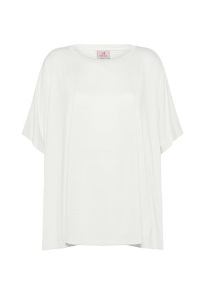 White oversized short-sleeve top with a round neckline and loose fit. Made of soft material, featuring minimal seams and a tag on the neck.