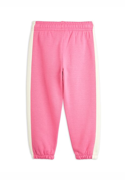 Rosa Sweatpants mit weißen Seitenstreifen, elastischem Bund und gerafften Bündchen. Hergestellt aus weichem, strukturiertem Stoff.