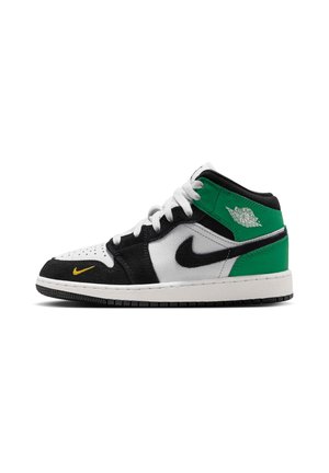 Mid-top sneaker with white, black, and green leather panels, white laces, black Nike swoosh, small yellow swoosh near toe, and Air Jordan logo on collar.