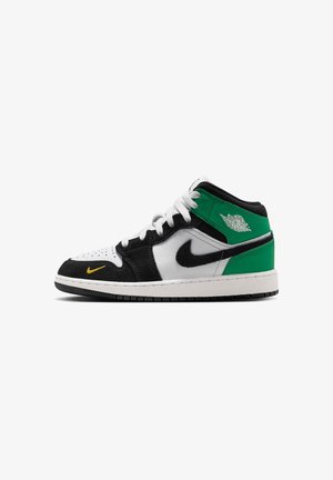 Mid-top sneaker with white, black, and green leather panels, white laces, black Nike swoosh, small yellow swoosh near toe, and Air Jordan logo on collar.