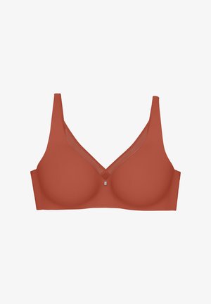 Biustonosz w ciepłym kolorze terakoty, z gładkimi miseczkami, szerokimi ramiączkami, dekoltem w kształcie litery V oraz przezroczystym akcentem z siateczki przy dekolcie.