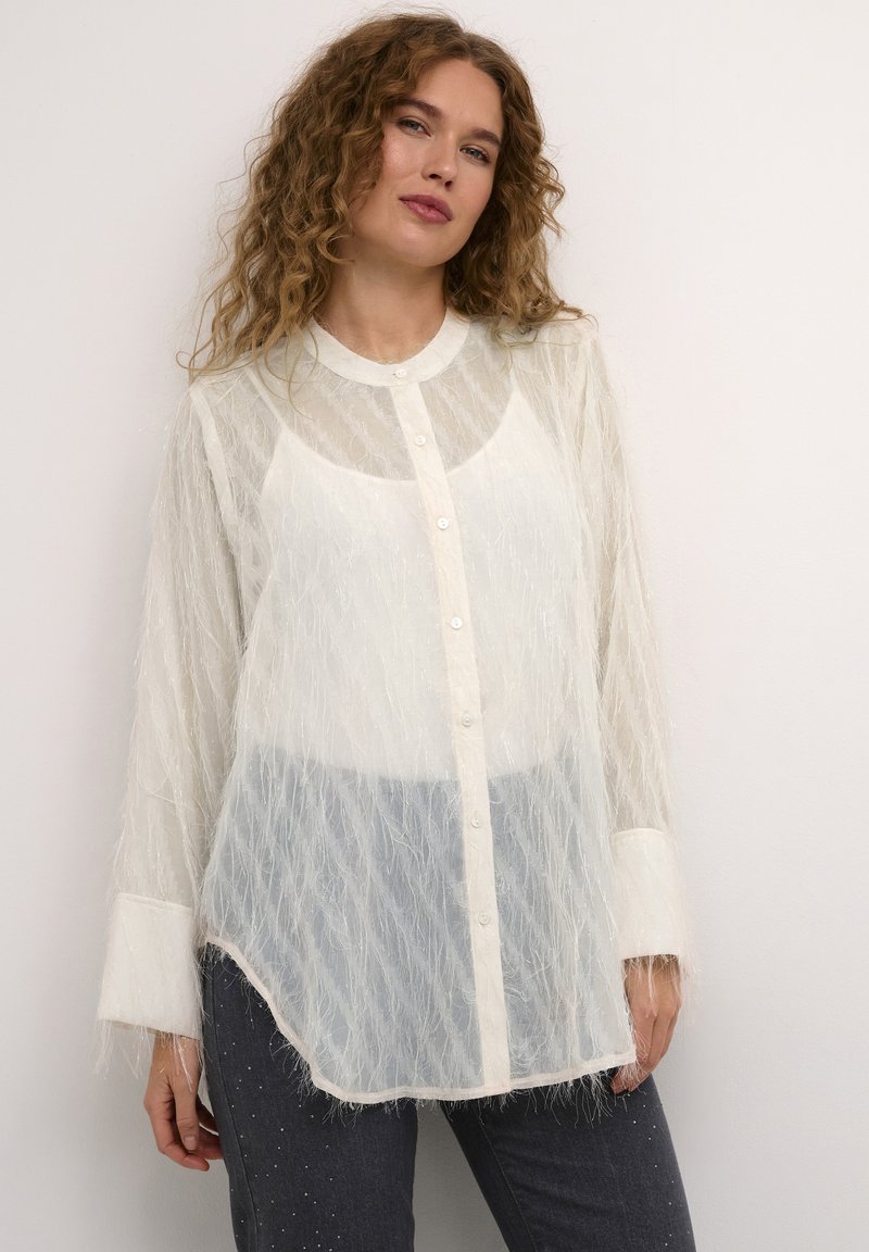 Sheer white blouse with textured, fuzzy material, featuring a button-up front, rounded collar, and long sleeves with contrasting cuffs.