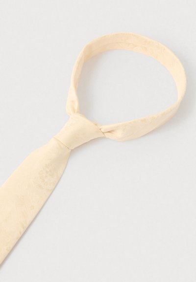 Světle žlutá kravata s jemným květinovým vzorem, vyrobená z hladké látky. Má klasický úzký tvar a standardní uzlový design.