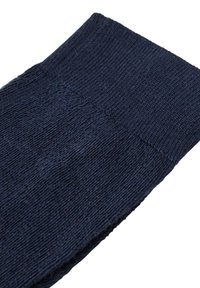 Laivastonsininen sukka, jossa on ribattu pinta ja vahvistettu kantapää sekä varvas. Materiaali vaikuttaa pehmeältä ja kestävältä, sopii päivittäiseen käyttöön.