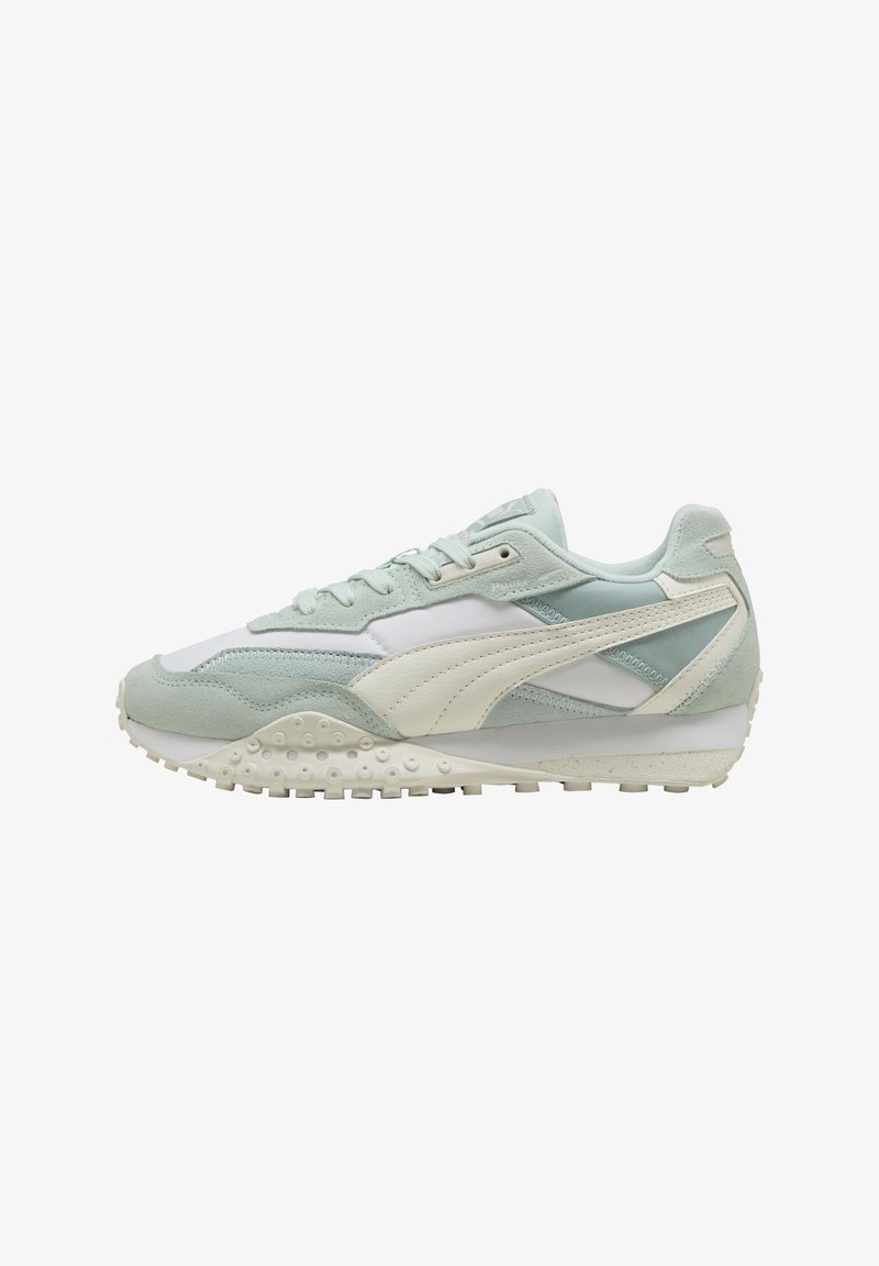 Light green and white sneakers with a mix of suede and mesh. Features a textured sole and side panel accents. Flat laces and padded collar.
