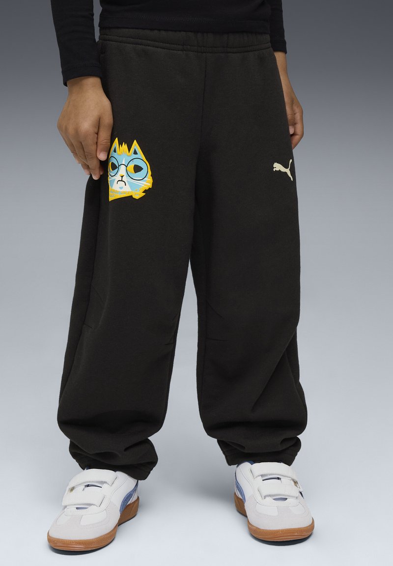Sorte sweatpants med løs pasform, der har et farverigt tegneserie-animal grafisk motiv på venstre ben og et lille hvidt Puma-logo på hoften.