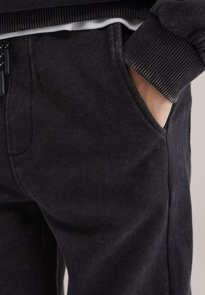 WE Fashion SALTY DOG - Jogginghose - black