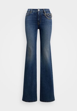 High-waisted dark blue flare jeans with faded thighs and a silver chain accessory attached to the right front belt loop.