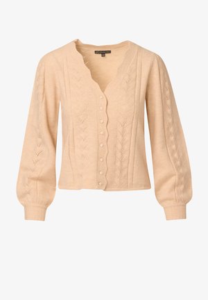 Beige cardigan met een v-hals, gegolfde randen en decoratieve bladdessins. Heeft lange, opgeblazen mouwen en een rij knopen aan de voorkant.