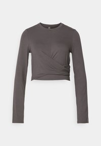 Gray long-sleeve cropped top with a round neckline and twisted front detail. Made from a soft, stretchy fabric for a fitted look.