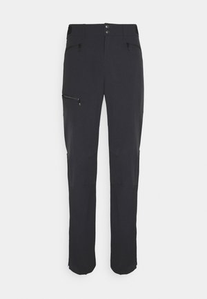 Pantalons de plein air noirs en tissu doux et extensible. Comprend des poches zippées, un design à jambes droites et des accents de genoux renforcés.