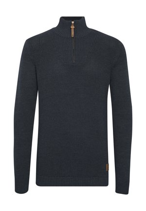 Pullover lavorato a maglia di un blu navy scuro con mezza cerniera. Presenta un motivo testurizzato sul corpo e polsini e orlo a coste. Etichetta in pelle sul lato.