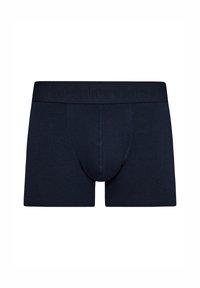 Boxers ajustados de color azul oscuro hechos de una tela suave, con una bolsa contorneada, que presentan un logotipo en relieve en la cinturilla y un diseño ajustado.