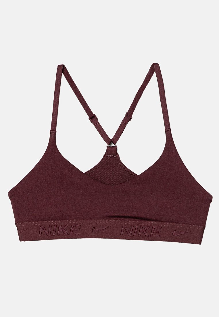 Reggiseno sportivo color bordeaux scuro con spalline incrociate regolabili e fascia elastica con loghi "NIKE" e simboli swoosh ripetuti.