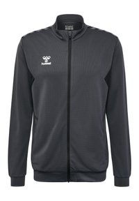 Zwarte zip-up jack van gestructureerde stof, met een staande kraag, contrasterende schouderstrepen en een logo op de borst.