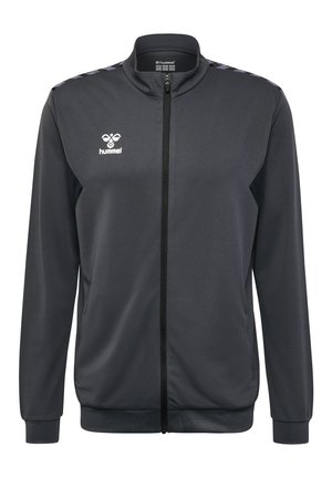 Schwarze Zip-Jacke aus strukturiertem Stoff, mit Stehkragen, kontrastierenden Schulterstreifen und einem Logo auf der Brust.