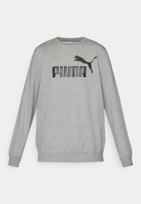 Sweat-shirt gris à manches longues avec logo Puma noir et graphisme de puma sautant centré sur la poitrine.