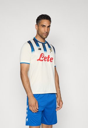 White short-sleeve jersey with blue and black vertical stripes, featuring a red "Lete" logo. Paired with blue athletic shorts.