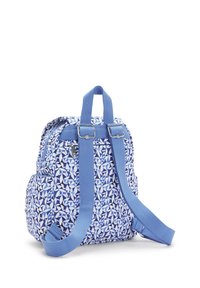 Blue patterned fabric backpack with adjustable straps, zippered pockets, and a top handle. Features a geometric leaf design in varying shades of blue.