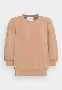 Suéter de color beige claro con cuello redondo, mangas abullonadas y puños acanalados. Textura suave con costuras curvas y un ajuste relajado.