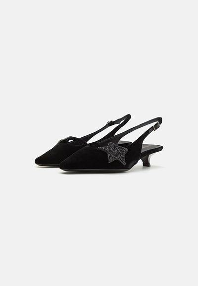 Black suede slingback shoes with a pointed toe, small heel, and star-shaped embellishment in a textured material.