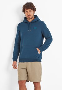 Blue hooded sweatshirt with a front pocket, featuring a small turquoise logo detail. Fabric is soft with a textured appearance.