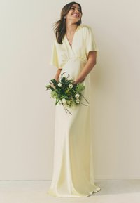 Next Apģērbs svinīgiem gadījumiem - pastel yellow
