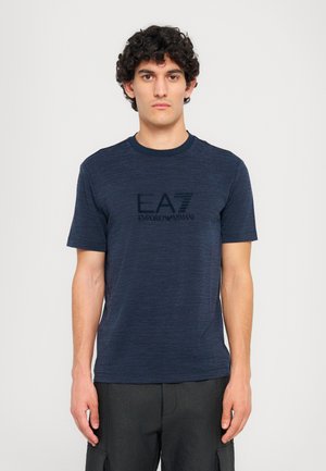 Navy blue short-sleeve t-shirt featuring a round neckline and a black EA7 Emporio Armani logo. Made from a textured, lightweight fabric.