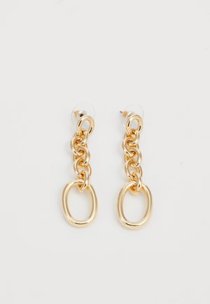 Aukso tonu auskarai su tarpusavyje susijungiančiomis grandinėmis, su apskritu akcentu apačioje. Baigti su skaidriais užsegimais, kad būtų užtikrintas saugus nešiojimas.