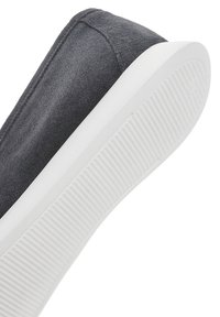 Gray suede slip-on shoe with a white rubber sole. The sole features ridges for grip, and the upper has a smooth texture with clean stitching.
