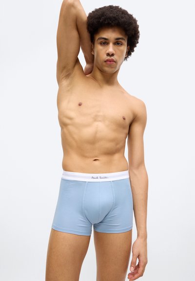 Boxer en coton bleu clair avec une ceinture élastique blanche arborant le logo "Paul Smith". Le design est ajusté et à texture lisse.