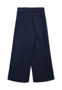 Pantaloni cropped a gamba larga di colore blu navy con alta vita e chiusura laterale a zip, esposti in piano su uno sfondo bianco.