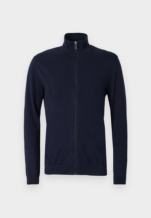 Navy zip-up sweater made of soft fabric, featuring a stand collar, long sleeves, and ribbed cuffs and hem for a fitted look.