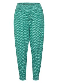 Gröna mönstrade byxor med smockad midja och justerbart knytband. Materialet är lätt och har en avslappnad passform med avsmalnande ben.