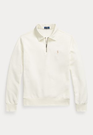 Cream-colored long-sleeve polo shirt with quarter zip, collar, ribbed cuffs and hem, and small embroidered logo on left chest.